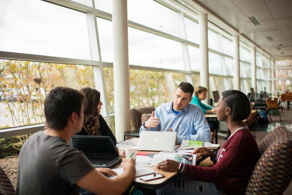 Professor Toth working with students